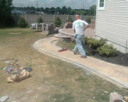 A man with a broom and a shovel.